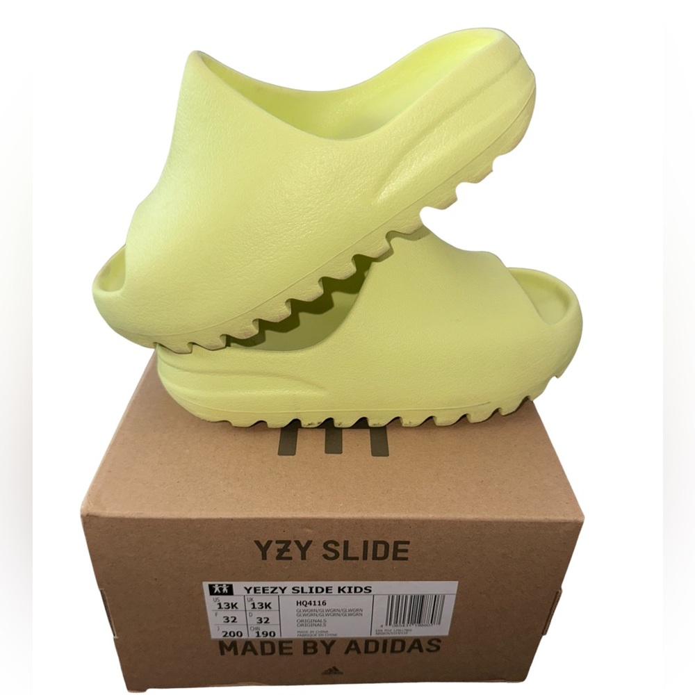 Kids Yeezy slide in Glow Green. Like New, Excellent condition! Worn once.
